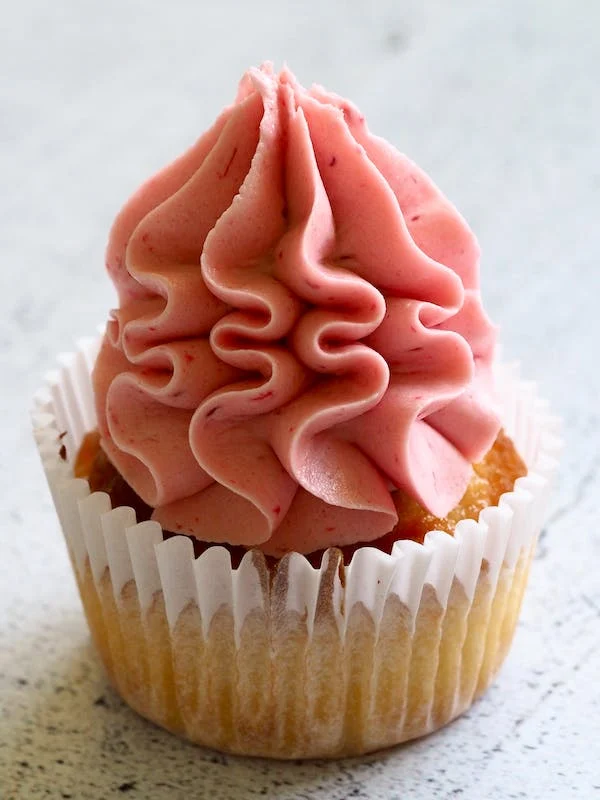 image of a pink frosted cupcake